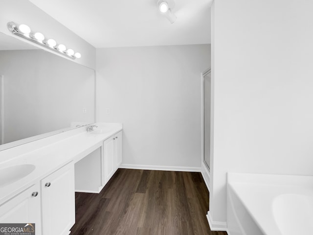 bathroom featuring wood-type flooring, vanity, and independent shower and bath