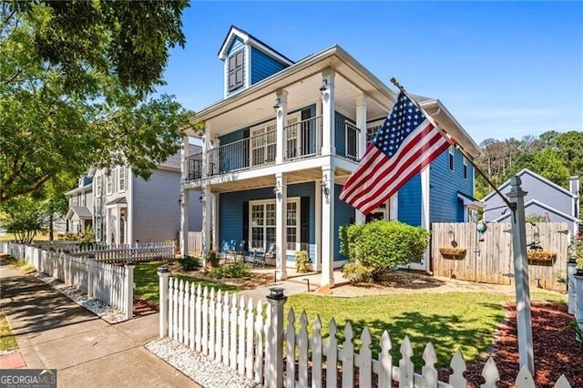 view of front of property featuring a balcony