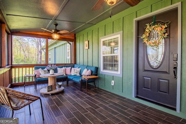 sunroom / solarium with lofted ceiling and ceiling fan