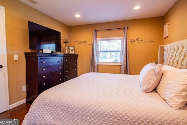 bedroom featuring dark hardwood / wood-style floors