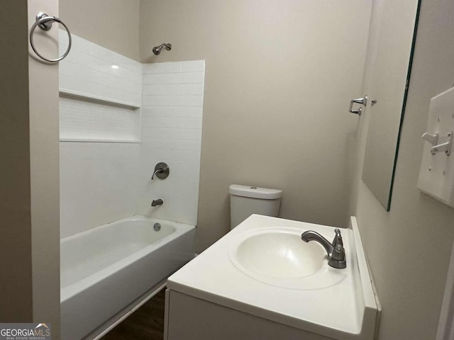 full bathroom featuring vanity, washtub / shower combination, and toilet