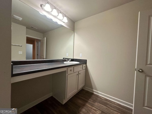 bathroom with wood-type flooring and vanity