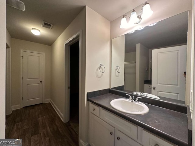 bathroom featuring hardwood / wood-style floors and vanity