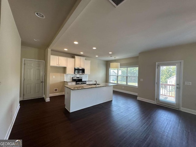 kitchen with dark hardwood / wood-style floors, sink, stainless steel appliances, an island with sink, and white cabinets