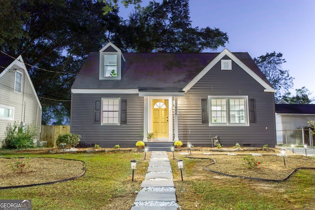 view of front of property with a front lawn