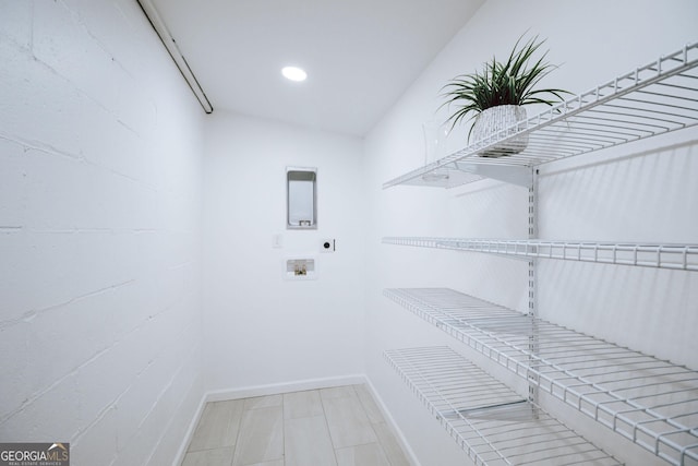1466 Hardin Ave, Atlanta, GA 30337 - laundry room featuring electric dryer hookup, hookup for a washing machine, and baseboards