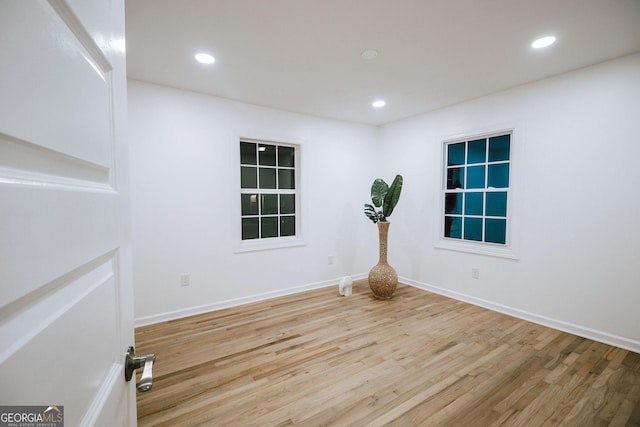 unfurnished room featuring light hardwood / wood-style floors