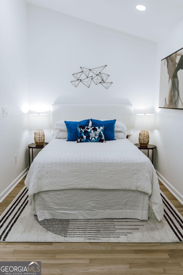 bedroom featuring hardwood / wood-style floors