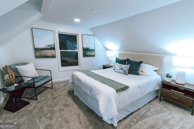 bedroom featuring carpet and lofted ceiling