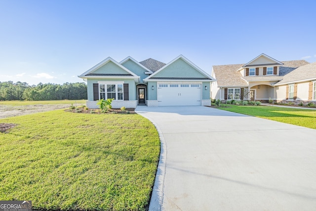 view of front of home featuring a front yard and a garage