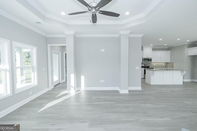 133 Amanda Trce, Kingsland, GA 31548 - unfurnished living room with ceiling fan, ornamental molding, recessed lighting, a raised ceiling, and light wood-style floors