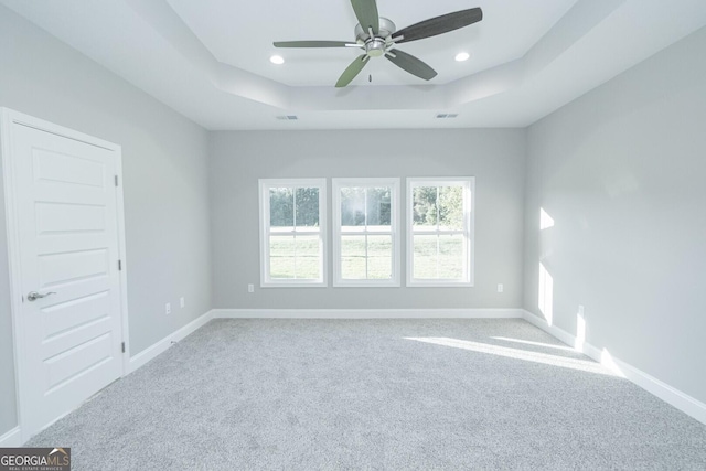 133 Amanda Trce, Kingsland, GA 31548 - carpeted spare room featuring a tray ceiling, plenty of natural light, a ceiling fan, and recessed lighting