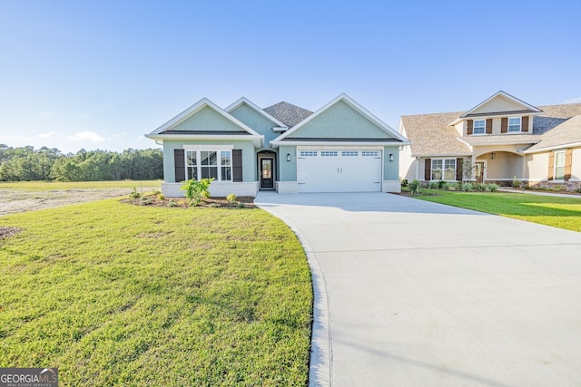 view of front facade with a garage and a front lawn