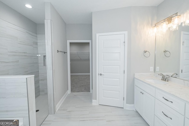 133 Amanda Trce, Kingsland, GA 31548 - full bathroom featuring walk in shower, vanity, a spacious closet, and marble finish flooring