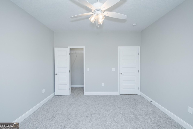 133 Amanda Trce, Kingsland, GA 31548 - unfurnished bedroom featuring carpet, a spacious closet, a ceiling fan, and a closet