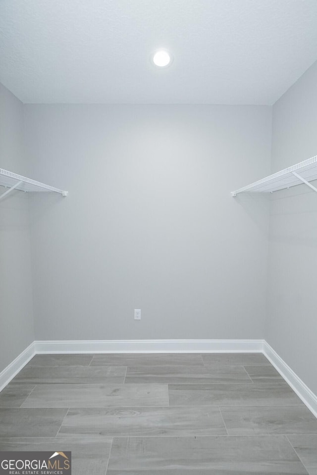 133 Amanda Trce, Kingsland, GA 31548 - walk in closet featuring wood finished floors
