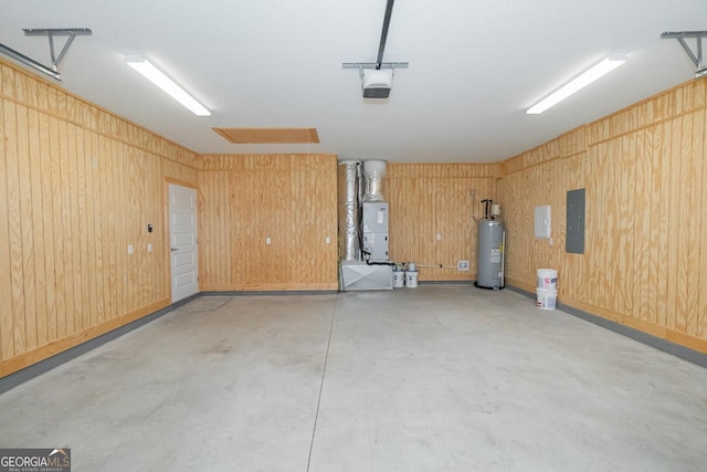 133 Amanda Trce, Kingsland, GA 31548 - garage with water heater, a garage door opener, electric panel, and wooden walls