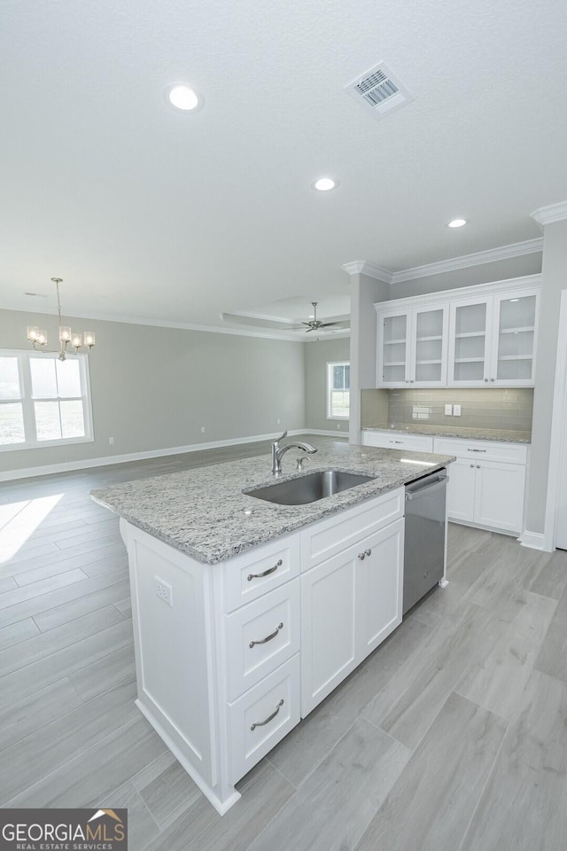 133 Amanda Trce, Kingsland, GA 31548 - kitchen featuring stainless steel dishwasher, crown molding, an island with sink, open floor plan, and a ceiling fan