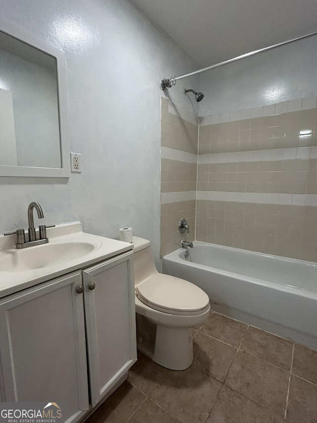 bathroom featuring vanity, bathing tub / shower combination, toilet, and tile patterned floors