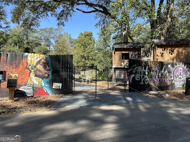 view of gate with fence