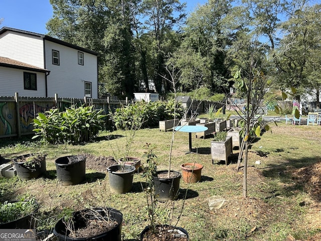 view of yard featuring a garden and fence