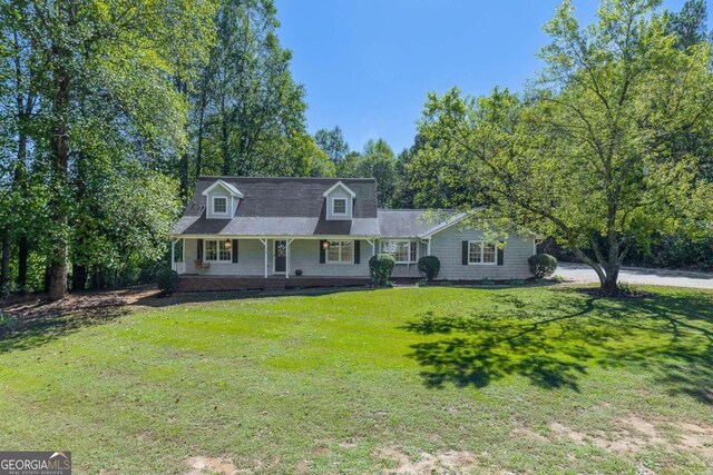 view of front of house with a front lawn and a porch