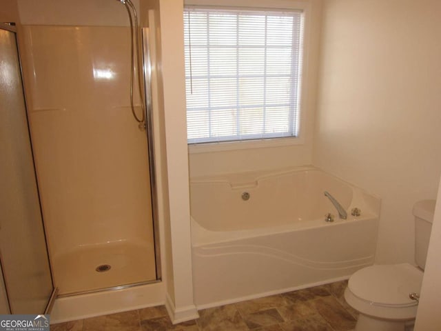 bathroom with toilet and independent shower and bath