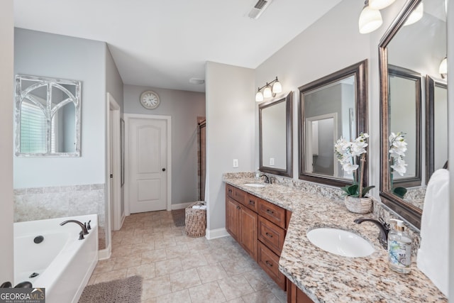 bathroom featuring tile patterned floors, vanity, and independent shower and bath