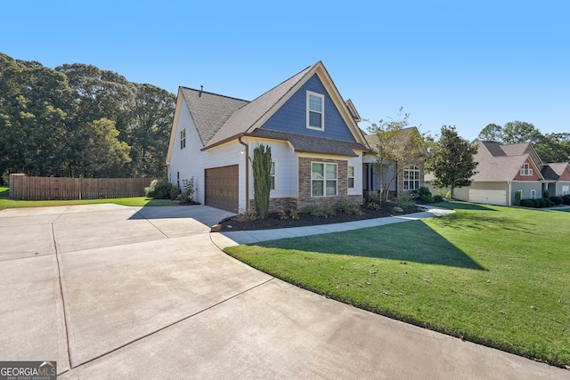 view of front of property with a front yard and a garage