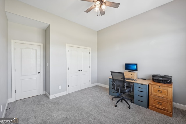 carpeted office with ceiling fan