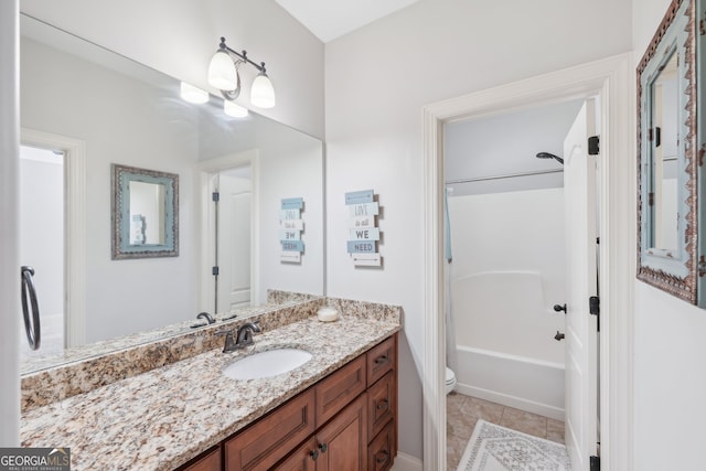 full bathroom with shower / tub combination, vanity, tile patterned flooring, and toilet