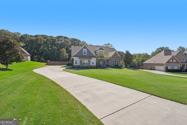 view of front of house featuring a front yard and a garage