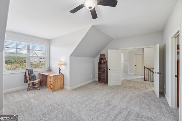 bonus room with ceiling fan, vaulted ceiling, and light carpet