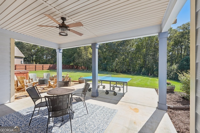 view of patio featuring ceiling fan