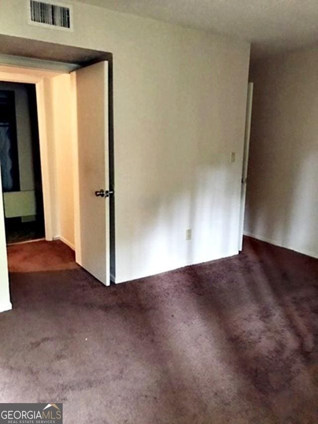 unfurnished room featuring carpet flooring