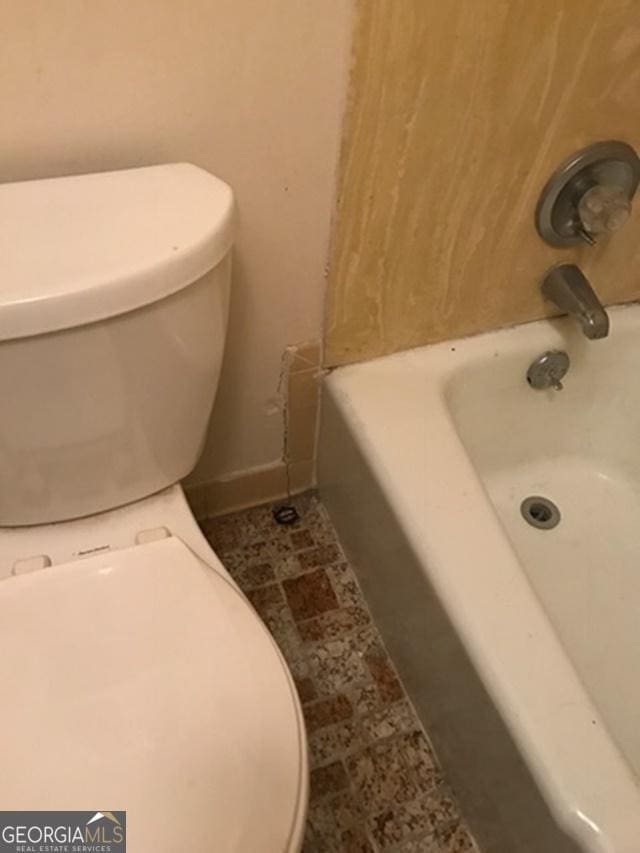 bathroom featuring toilet