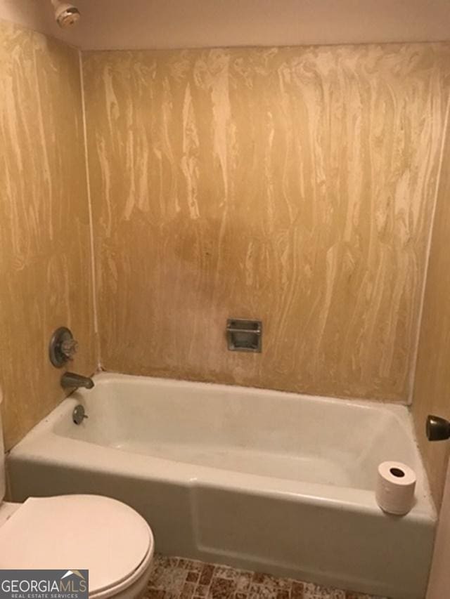 bathroom with shower / tub combination and toilet