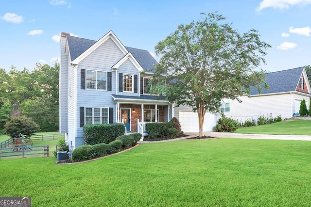 view of front of house with cooling unit and a front yard