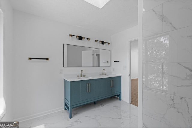 bathroom with vanity and a textured ceiling