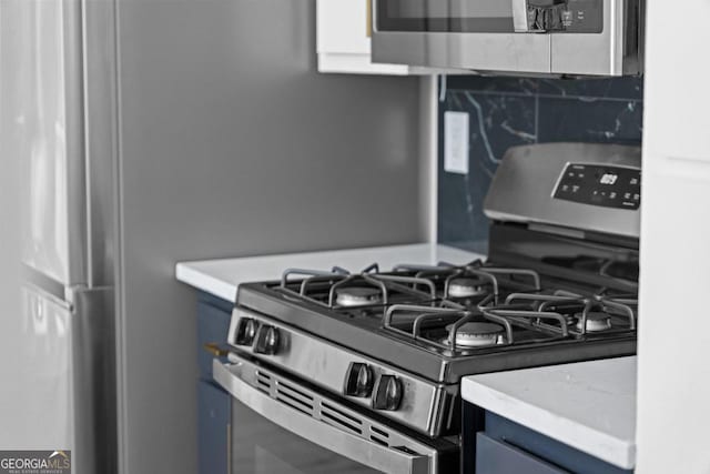 kitchen featuring decorative backsplash and stainless steel appliances