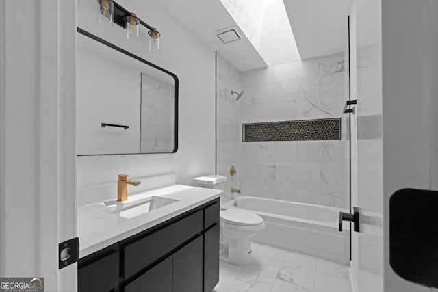 full bathroom featuring vanity, tiled shower / bath combo, and toilet