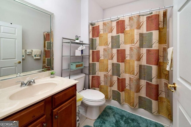 bathroom with tile patterned floors, walk in shower, vanity, and toilet