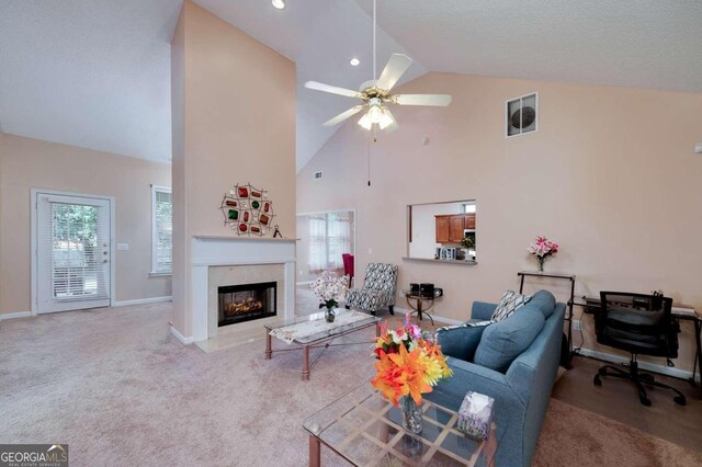 living room featuring light colored carpet, high vaulted ceiling, and ceiling fan