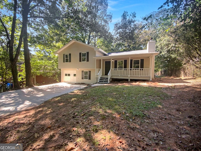 split level home with a porch and a garage