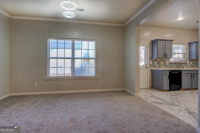 kitchen with tasteful backsplash, plenty of natural light, black dishwasher, and gray cabinetry