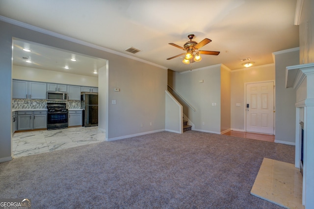 unfurnished living room with crown molding, ceiling fan, and light colored carpet