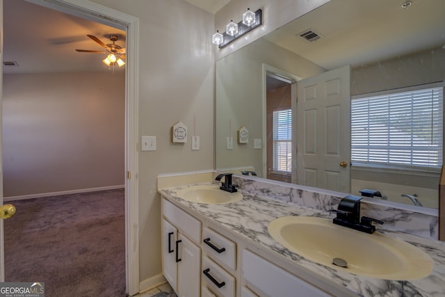 bathroom featuring ceiling fan and vanity