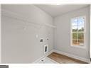 laundry room featuring hookup for an electric dryer