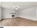 unfurnished living room with hardwood / wood-style flooring and a fireplace