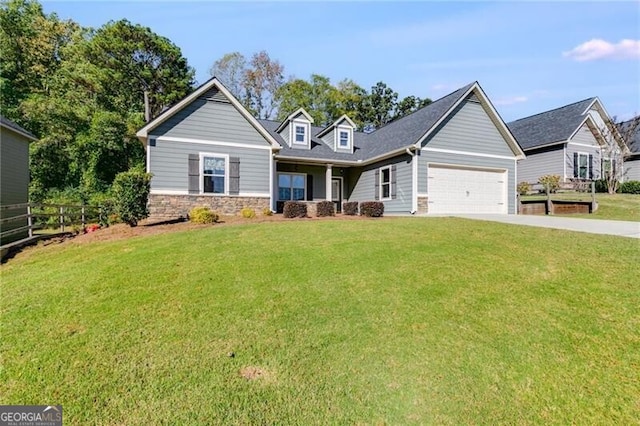 view of front of house featuring a front yard and a garage